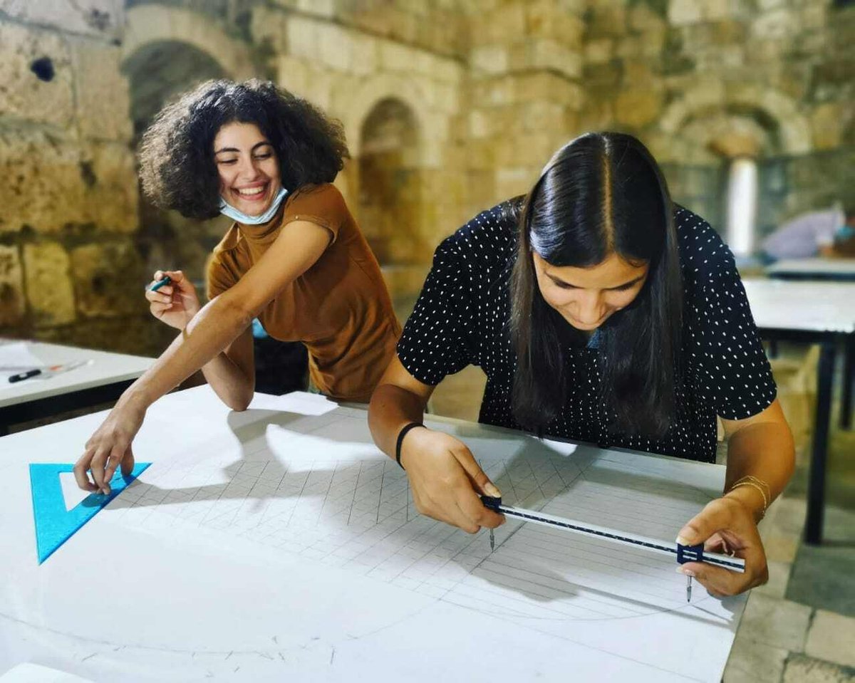 Two female participants working on the Syrian stone masonry training in Tripoli (c) World Monuments Fund.